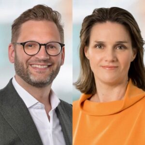 Porträt von Christian Wagner und Katrin Kerner, beide lächelnd, vor einem hellen, unscharfen Hintergrund.